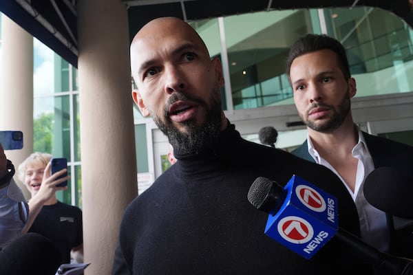 Influencer brothers Andrew and Tristan Tate arrive, Thursday, Feb. 27, 2025, in Fort Lauderdale, Fla. The brothers were charged with human trafficking in Romania and arrived in the U.S. after authorities lifted travel restrictions. (AP Photo/Marta Lavandier)