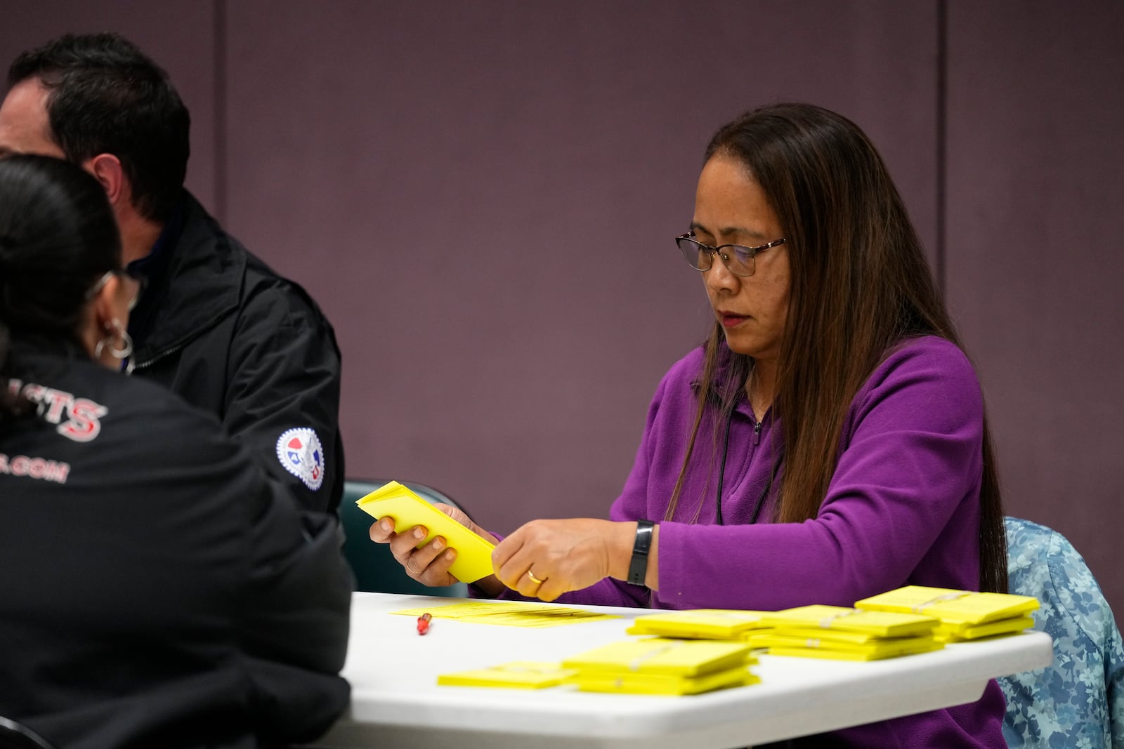 Volunteers tally votes on a new contract offer from Boeing, Wednesday, Oct. 23, 2024, at Seattle Union Hall in Seattle. (AP Photo/Lindsey Wasson)