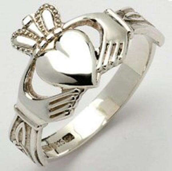 The traditional Claddagh ring features two hands clasping a heart with a crown above it. The hands signify friendship, while the heart represents love and the crown loyalty.