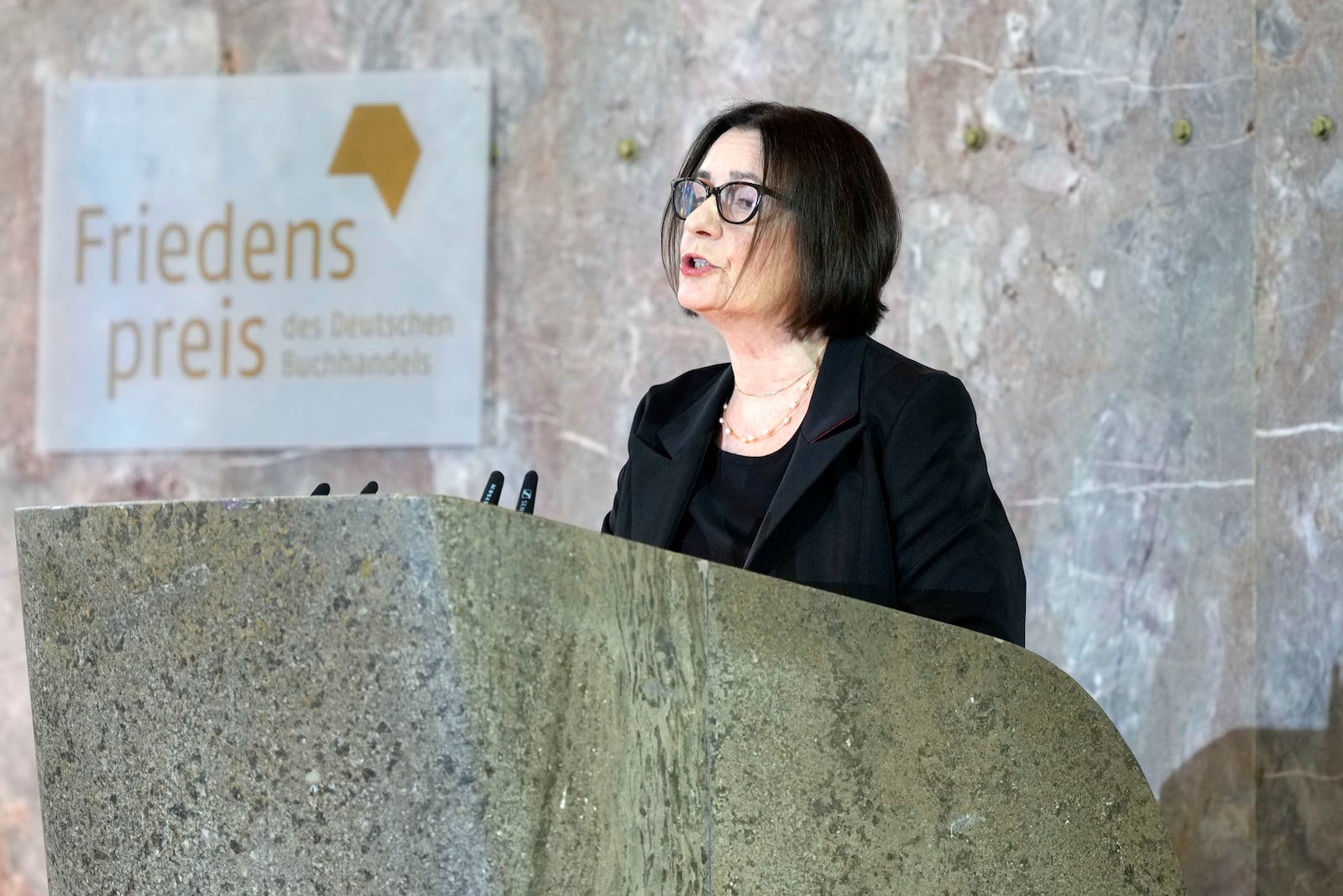 Russian Memorial founder Irina Scherbakowa delivers the laudatio for American journalist and historian Anne Applebaum who is awarded the Peace Prize of the German Publishers and Booksellers Association during a ceremony at the St. Paul's Church in Frankfurt, Germany, Sunday, Oct. 20, 2024.(AP Photo/Martin Meissner, Pool)