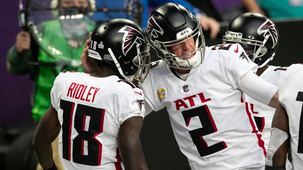 Atlanta Falcons quarterback Matt Ryan (2) celebrates with wide receiver Calvin Ridley (18) after Ridley caught a pass for a touchdown in the second quarter against the Minnesota Vikings, Sunday, Oct. 18, 2020, in Minneapolis. (David Berding/AP)