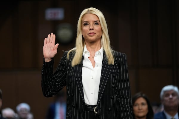 Pam Bondi, President-elect Donald Trump's choice to lead the Justice Department as attorney general, is sworn in before the Senate Judiciary Committee for her confirmation hearing, at the Capitol in Washington, Wednesday, Jan. 15, 2025. (AP Photo/Ben Curtis)