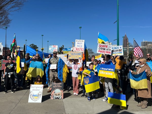 Protesters condemned Trump's rhetoric at the Oval Office meeting with Zelenskyy. (Ashley Ahn for AJC)