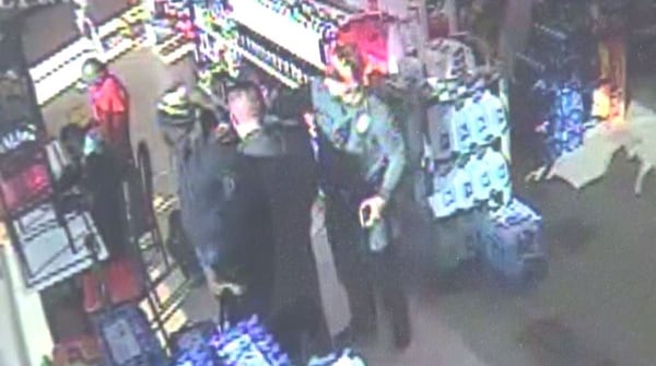 Video surveillance photo of Canton police offiers arresting an escaped prisoner from Connecticut. (Credit: Channel 2 Action News)