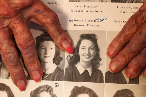 Shirley Jones, 96, points to her senior yearbook photo. Jones graduated in 1943 from Girls High School in Atlanta. 
Curtis Compton / Curtis.Compton@ajc.com