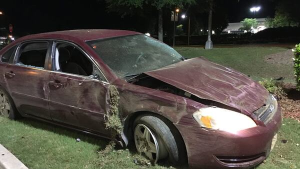 A man accused of shooting at a popular East Point club crashed into a tree. (Credit: Channel 2 Action News)