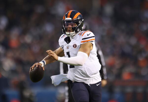 Chicago Bears quarterback Justin Fields (1) looks for receivers downfield against the Arizona Cardinals at Soldier Field on Dec. 24, 2023, in Chicago. (Trent Sprague/Chicago Tribune/TNS)