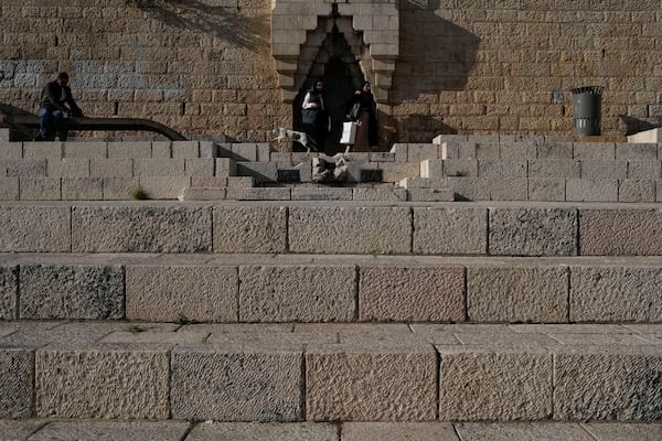 Women walk near the Damascus Gate outside Jerusalem's Old City, Tuesday, Dec. 3, 2024. (AP Photo/Matias Delacroix)