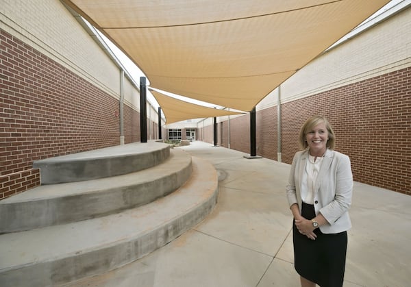 Henry County Superintendent Mary Elizabeth Davis on Wednesday checks out the outdoor classroom at McDonough Middle School. The school is one of two opening Thursday in fast-growing Henry County, which expects its student population to hit about 44,000 students this year. BOB ANDRES / ROBERT.ANDRES@AJC.COM