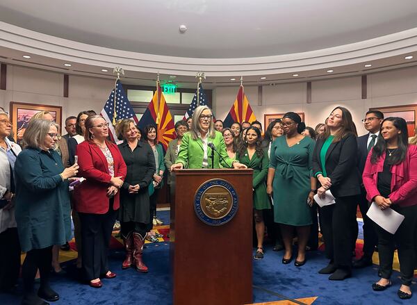 Arizona Gov. Katie Hobbs celebrates passages of abortion ballot measure surrounded by Democratic lawmakers and advocates on Monday, Nov. 25, 2024, at the State Capitol in Phoenix. (AP Photo/Sejal Govindarao)