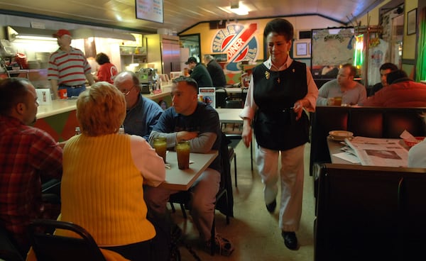 Former owner Kevin Huggins (left) is at the counter at Silver Grill. (BECKY STEIN / Special)