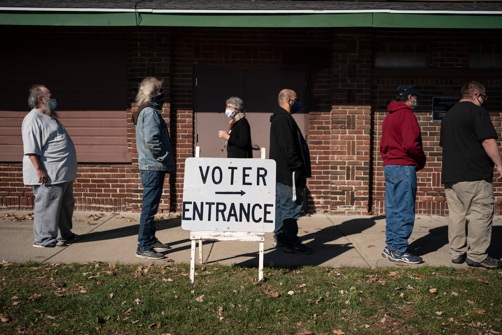 FILE - In this Tuesday, Nov. 3, 2020, file photo, voters wait in line outside a polling center on Election Day, in Kenosha, Wis. (AP Photo/Wong Maye-E, File)