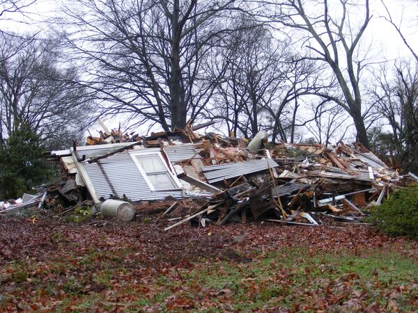 One of the homes on the land is torn down last month. (Courtesy/Susan Hood)