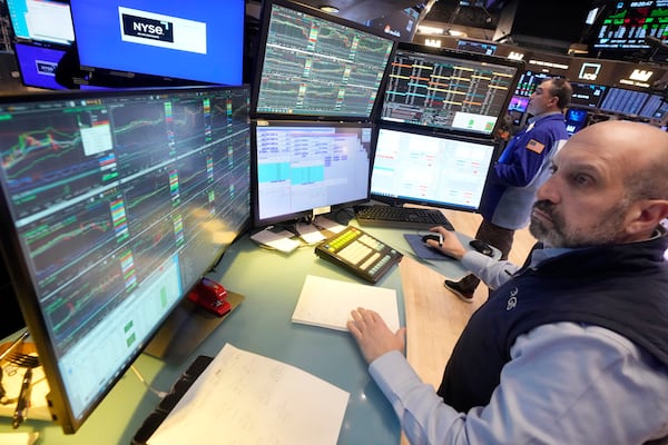 Specialist James Denaro works on the floor of the New York Stock Exchange, Wednesday, March 12, 2025. (AP Photo/Richard Drew)