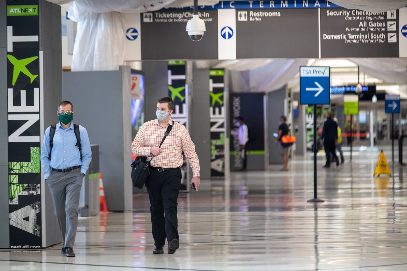 04/28/2020 - Atlanta, Georgia  - People wear masks as they walk through Atlanta's Hartsfield-Jackson International Airport, Tuesday, April 28, 2020. (ALYSSA POINTER / ALYSSA.POINTER@AJC.COM)