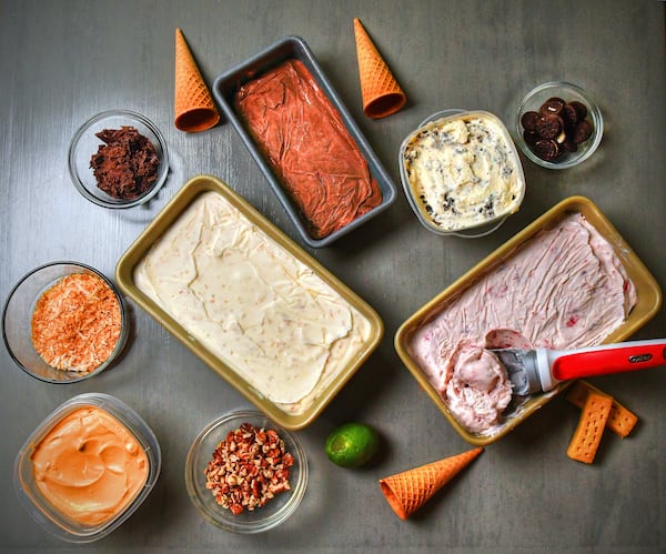 Let no-churn ice cream become your obsession this summer. Starting at top center going clockwise: Double Chocolate, Cookies 'N' Cream, Roasted Strawberry, Coconut and Lime and Salted Caramel Bourbon Ice Cream (far left lower). Metal loaf pans or plastic containers with tight-fitting lids will work. Styling by Susan Puckett / Chris Hunt for the AJC