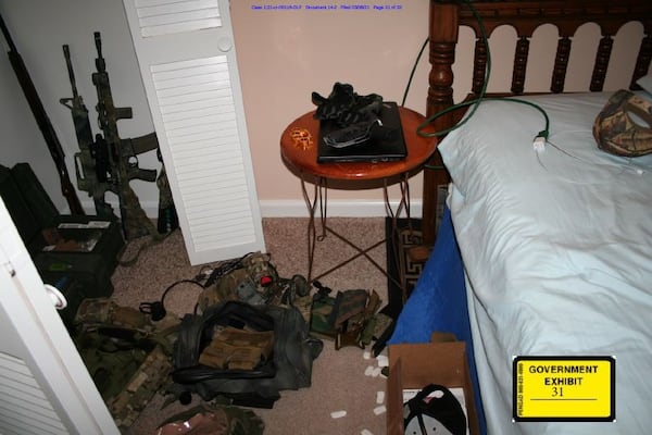 A photo taken by the FBI investigators shortly after the 2021 arrest of Americus attorney William McCall Calhoun Jr. shows an arsenal of guns and ammunition seized during his arrest.