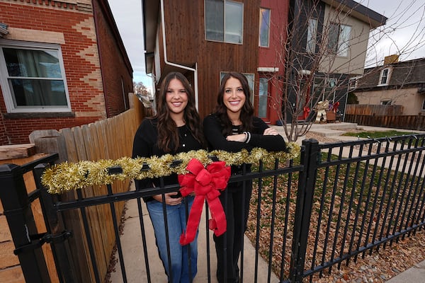 Jacqueline and Alexa Child stand for a portrait in their neighborhood Wednesday, Dec. 18, 2024, in Denver. (AP Photo/David Zalubowski)