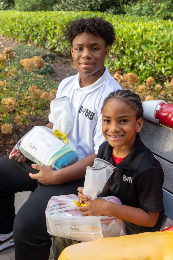 CJ Matthews (left, age 16) & his brother Kollin (7) prepare to make a delivery to the Ronald McDonald House as part of their Blankies 4 My Buddies nonprofit. When CJ was 5, his mother tragically lost his baby sister during pregnancy. CJ decided to redirect his grief to give back and spread positivity. He came up with this initiative to offer children comfort and security through blankets. His younger brother, Kollin, is now helping collect and donate the blankets. PHIL SKINNER FOR THE ATLANTA JOURNAL-CONSTITUTION