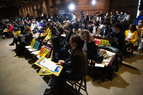 Participants listen to the speakers during the Asian Justice 1-year anniversary of the spa shootings rally in Atlanta on March 16, 2022.   STEVE SCHAEFER FOR THE ATLANTA JOURNAL-CONSTITUTION