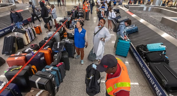 Delta Air Lines employees were busy Wednesday, July 24, 2024, at Hartsfield-Jackson International Airport as started to recover from a meltdown that left hundreds of thousands of travelers stranded around the country after a technology outage caused by a faulty CrowdStrike security update. (John Spink/AJC)