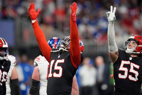 Atlanta Falcons' Matthew Judon celebrates sacking New York Giants quarterback Drew Lock (2) in the second half of an NFL football game in Atlanta, Sunday, Dec. 22, 2024. (AP Photo/Mike Stewart)