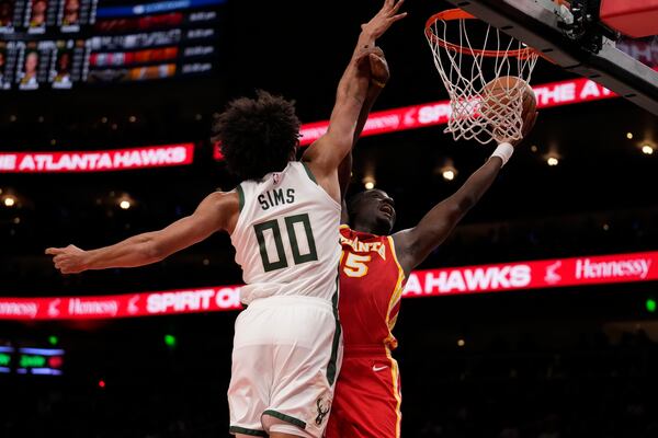 Atlanta Hawks center Clint Capela (15) misses a shot against Milwaukee Bucks center Jericho Sims (00) in the first half of an NBA basketball game, Tuesday, March 4, 2025, in Atlanta. (AP Photo/Brynn Anderson)