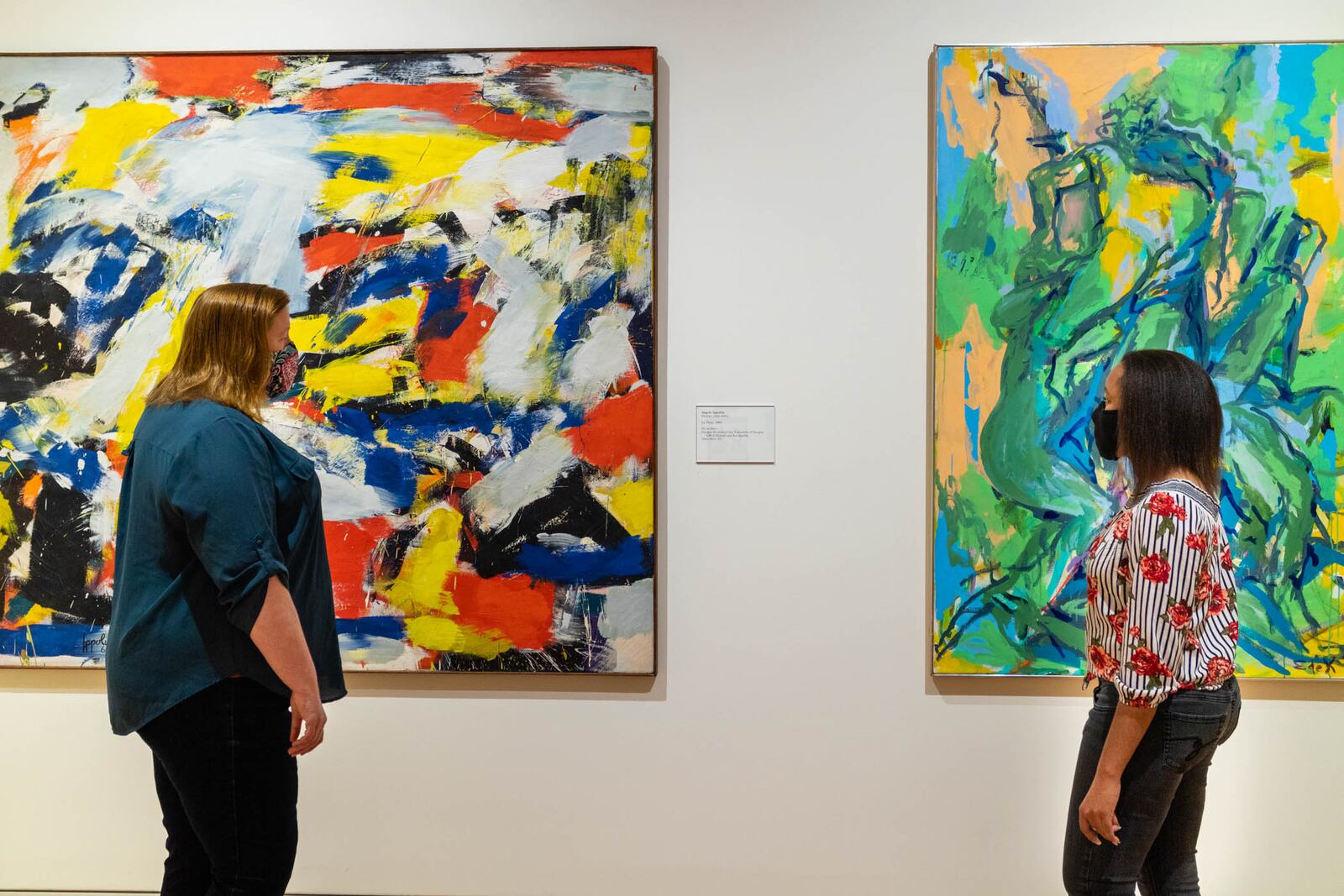 Visitors wearing masks and practicing social distancing view art by Angelo Ippolito and Elaine de Kooning at the Georgia Museum of Art on the UGA campus in Athens.