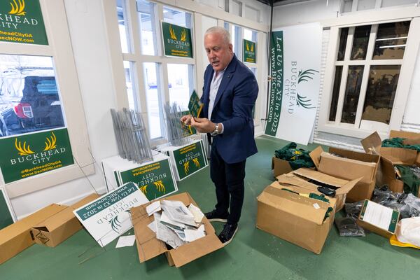 Bill White, who became the face of an effort pushing for Buckhead's secession from Atlanta, looks through some of the boxes that are left to move from the Buckhead City Committee's headquarters. The group is set to shut down in September, and White is planning to move out of Buckhead. (Steve Schaefer/steve.schaefer@ajc.com)