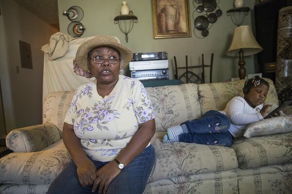  Sandra Gordon (left) talks about a possible property tax hike on her home in Atlanta’s Old Fourth Ward. Gordon, 61, takes care of her 5-year-old grandniece. (ALYSSA POINTER/ALYSSA.POINTER@AJC.COM)