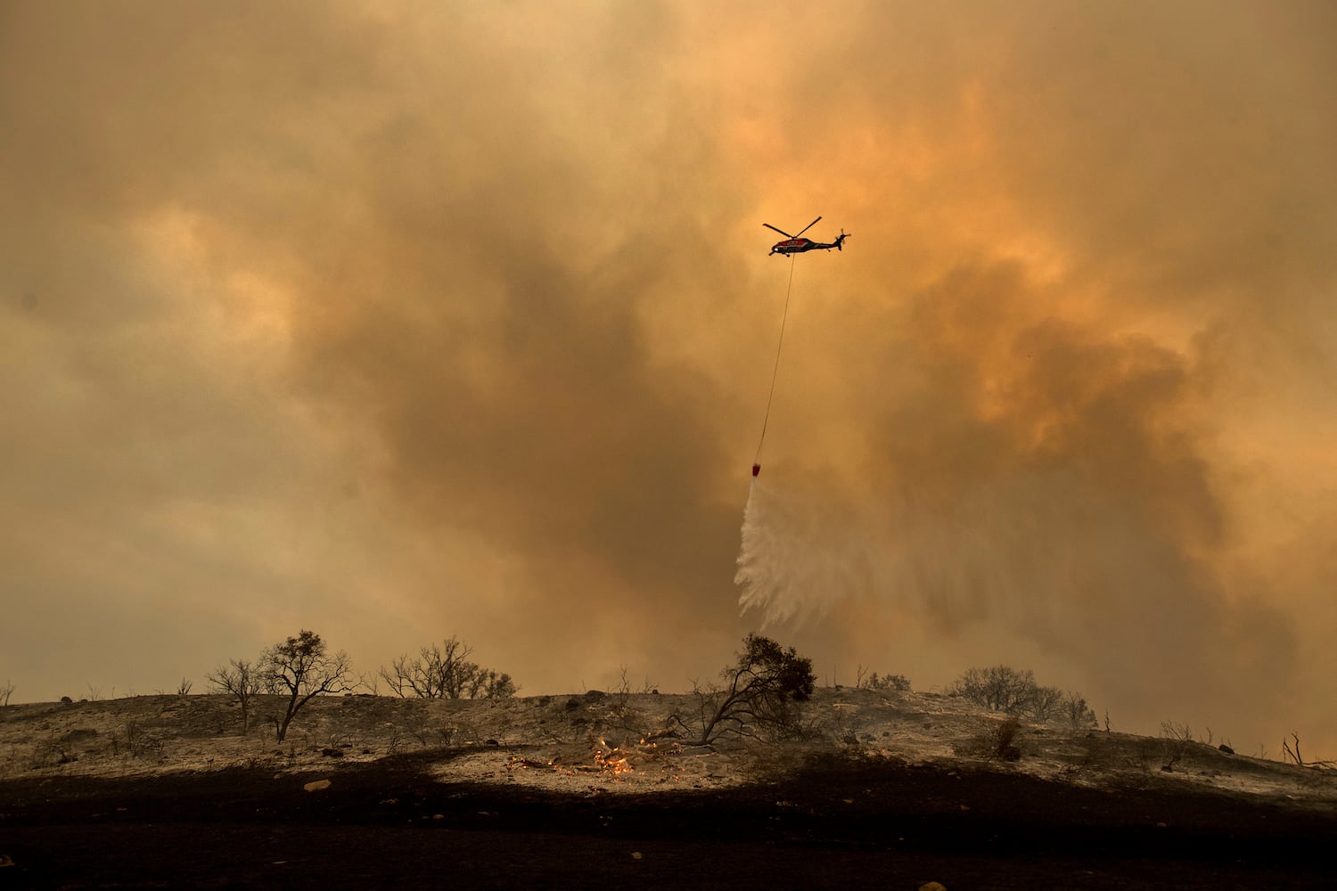 Photos: California wildfires burn thousands of acres, force evacuations