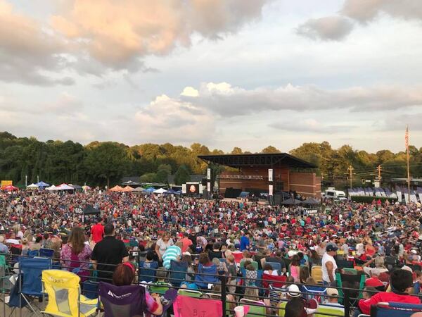 A crowd enjoys a recent concert at the Northside Hospital-Cherokee Amphitheater located in the Park at City Center in Woodstock. A series of free summer concerts put on by the city bring in big name artists and crowds, many of whom claim their places with lawn chairs days before. An estimated 15,000 people attended a free 38 Special concert on September 8. (City of Woodstock)