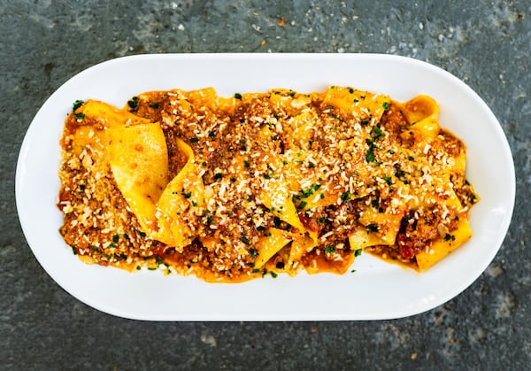 Housemade pappardelle with bolognese gravy and American parmesan is served at BoccaLupo. CONTRIBUTED BY HENRI HOLLIS