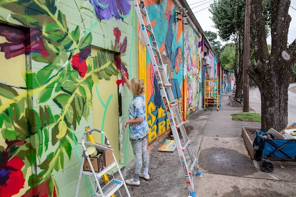 Artist are hard at work transforming these walls into an outdoor gallery of mural art and style writing. (Photo Courtesy of Isadora Pennington)