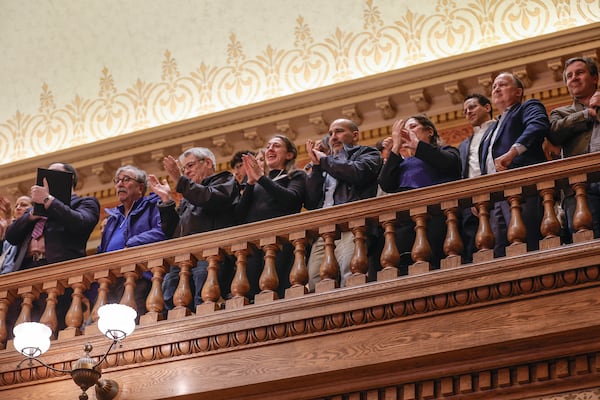 Members of the Jewish community clap after the passage of the antisemitism bill in the state Senate on Thursday. (Natrice Miller/Natrice.miller@ajc.com)