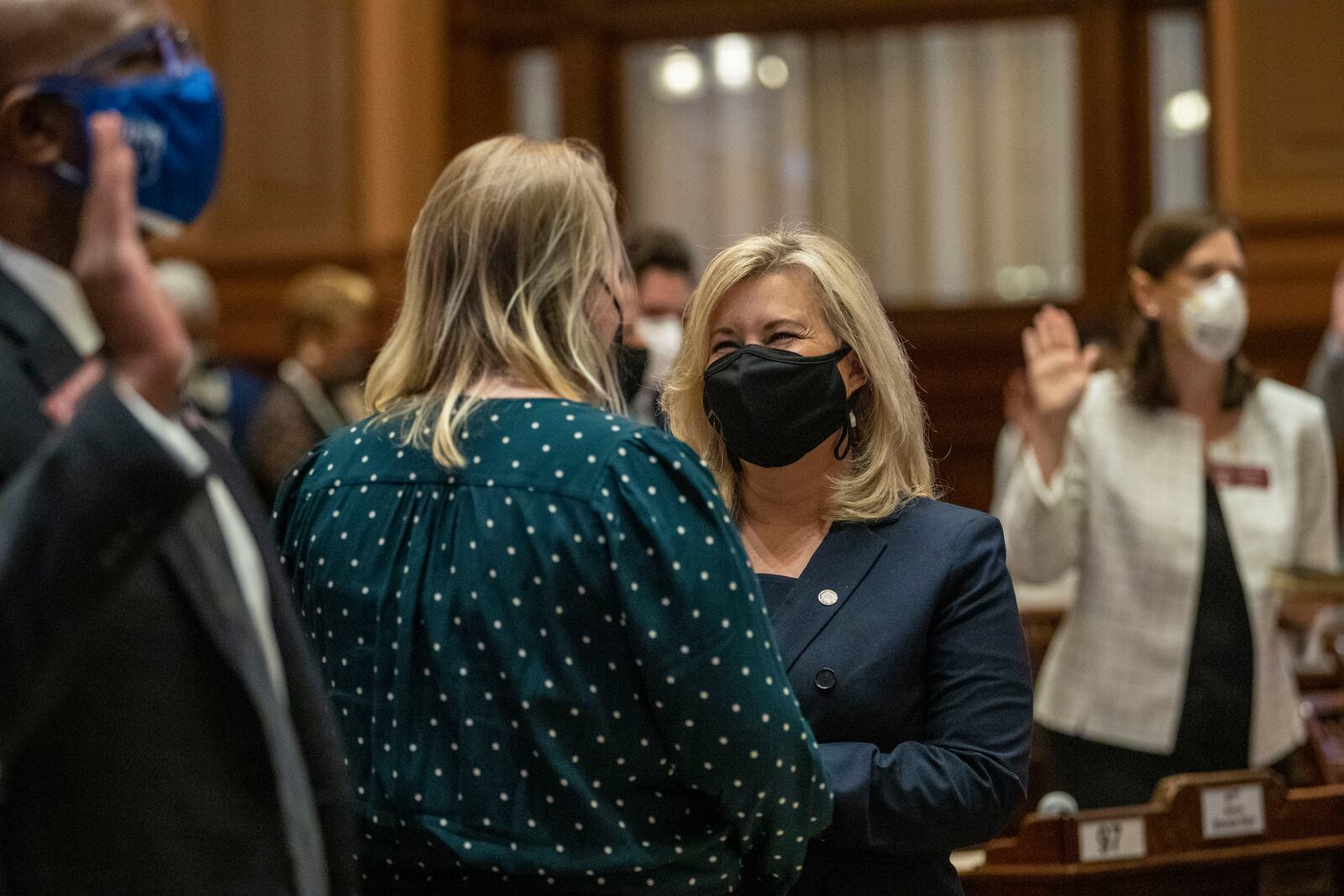 01/11/2021 — Atlanta, Georgia — Georgia State Rep. Shea Robert participates in a swearing-in with her daughter Brigid Arndt inside the House Chambers during the first day of the 2021 legislative session at the Georgia State Capitol building in downtown Atlanta, Monday, January 11, 2021. (Alyssa Pointer / Alyssa.Pointer@ajc.com)