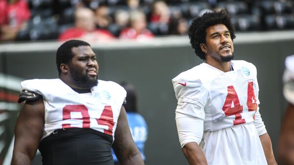 Atlanta Falcons defensive tackle Deadrin Senat (94) and linebacker Vic Beasley (44) during open practice  Sunday, July 29, 2018, at Mercedes-Benz Stadium in Atlanta.