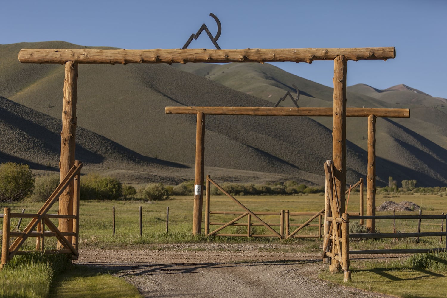 500-acre property has log cabins, mountain views