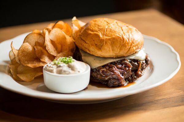  Achie's Wagyu Burger with French onion jus, Gruyere, brioche bun. Photo credit- Mia Yakel.