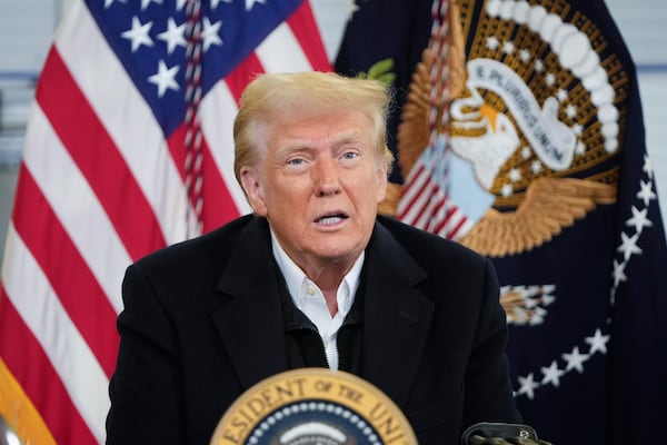 President Donald Trump is briefed on the effects of Hurricane Helene at Asheville Regional Airport in Fletcher, N.C., Friday, Jan. 24, 2025. (AP Photo/Mark Schiefelbein)