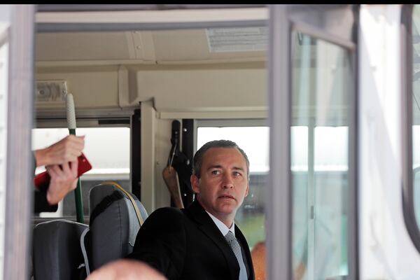 Tony Spell, pastor of the Life Tabernacle Church, sits in the drivers seat of one of his church buses as he prepares to leave the East Baton Rouge Parish jail after posting bond in Baton Rouge, La., Tuesday, April 21, 2020. Louisiana authorities arrested the pastor on an assault charge on Tuesday after he admitted that he drove his church bus toward a man who has been protesting his decision to hold mass gatherings in defiance of public health orders during the coronavirus pandemic. (AP Photo/Gerald Herbert)