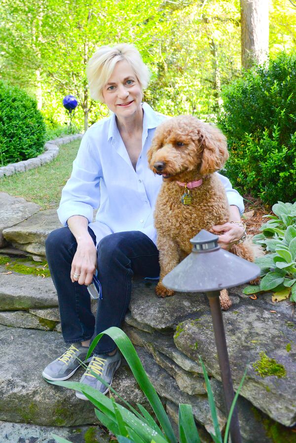 Floral and event designer Jill Helmer, with her mini goldendoodle, Winnie, is a member of the Ladies of the Lake Garden Club in Peachtree Heights East. The club is holding its 31st annual Garden Party on May 7 at the restored Duck Pond Park in her Atlanta neighborhood.