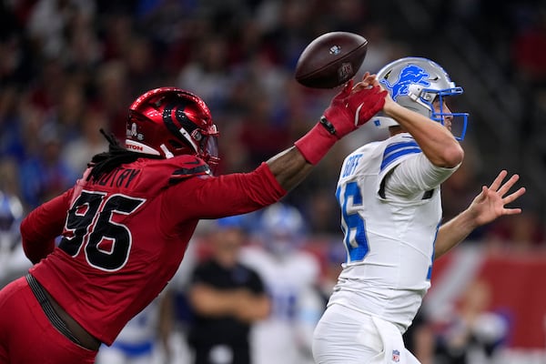 Houston Texans defensive end Denico Autry (96) hits Detroit Lions quarterback Jared Goff (16) as he throws a pass during the first half of an NFL football game, Sunday, Nov. 10, 2024, in Houston. (AP Photo/Eric Christian Smith)