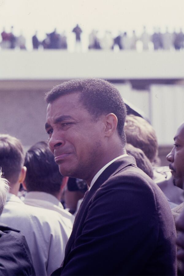 A mourner attempts to hold back tears during the memorial march for the Rev. Martin Luther King Jr. from Ebenezer Baptist Church to Morehouse College in Atlanta on April 9, 1968. DECLAN HAUN / CONTRIBUTED BY CHICAGO HISTORY MUSEUM