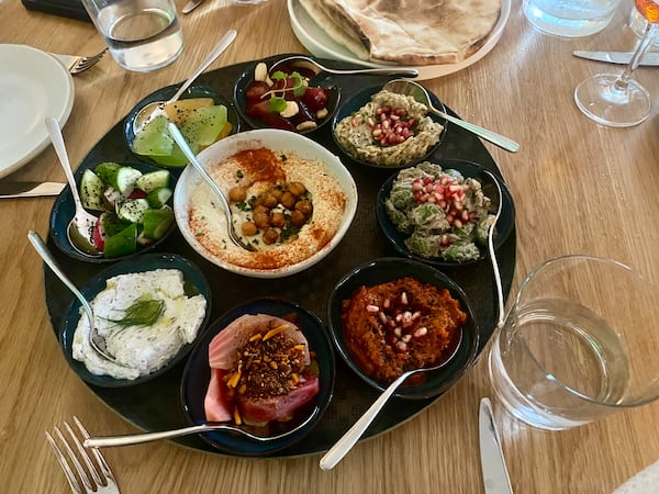 The mezze platter at Elektra includes a selection of spreads and dips as well as a chef's choice of chilled vegetable and fruit preparations. (Ligaya Figueras/ligaya.figueras@ajc.com)