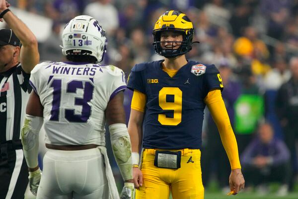 Michigan quarterback J.J. McCarthy (9) during the first half of the Fiesta Bowl NCAA college football semifinal playoff game against TCU, Saturday, Dec. 31, 2022, in Glendale, Arizona. (AP Photo/Rick Scuteri)