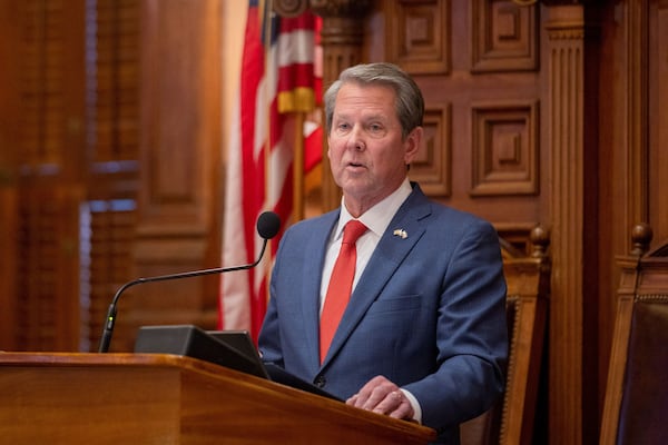 Georgia Gov. Brian Kemp addresses the House of Representatives at the Capitol in Atlanta on March 28, 2024. Republicans in metro Atlanta swing districts are keeping their distance<strong id="strong-e62fc631d3cac4a189ad549abb9b92cc"> </strong>from Trump and instead aligning themselves with<strong id="strong-874ea3eee4842d0923fd4831a88f7b06"> </strong>the popular Kemp. (Arvin Temkar/The Atlanta Journal-Constitution/TNS)