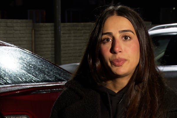 In this image from video, The Helping Handzzz Foundation creator Nadine Daoud listens to a reporter's question during an interview Friday, March 7, 2025, in Dearborn, Mich. (AP Photo/Mike Householder)