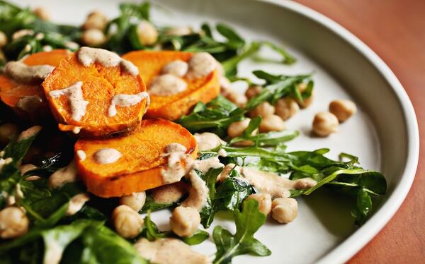 Sweet Potato Medallions with Almond Sauce are served over a Chickpea Salad. (Juli Leonard/Raleigh News & Observer/TNS)