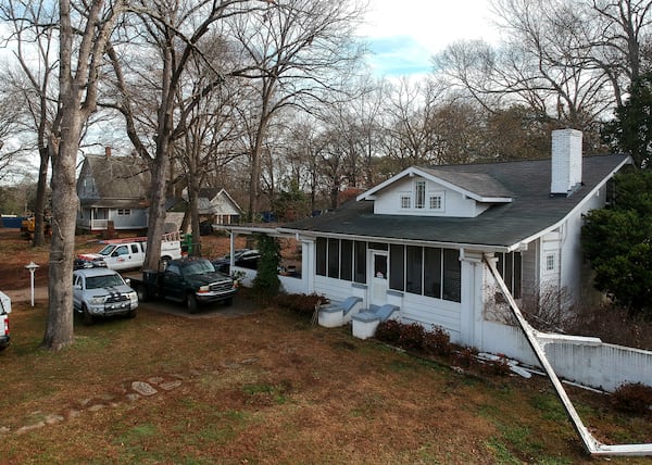 The NAMB hopes to demolish  this house at 961 Rowland Street, and another (visible in the background through the trees) at 3673 Hill Street.  STEVE SCHAEFER / SPECIAL TO THE AJC